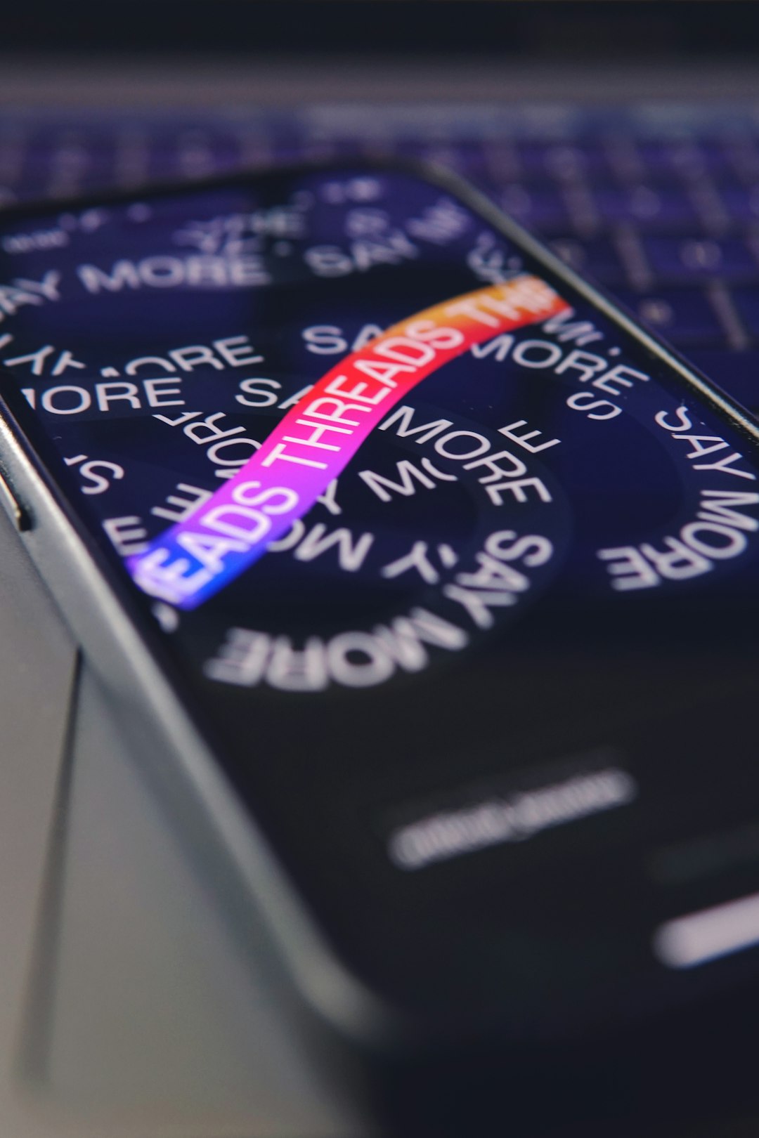 a-close-up-of-a-cell-phone-on-a-laptop-garcfbraafe